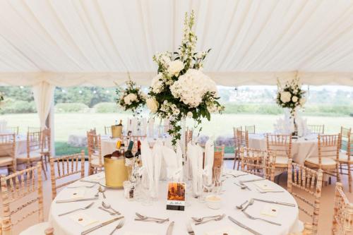 table flowers in marquee