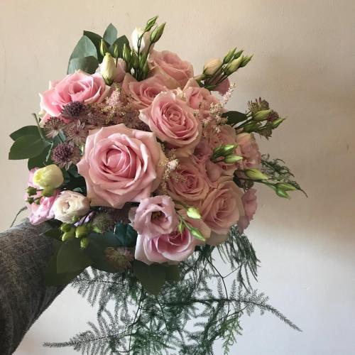 Pink Brides bouquet with trails to the front 